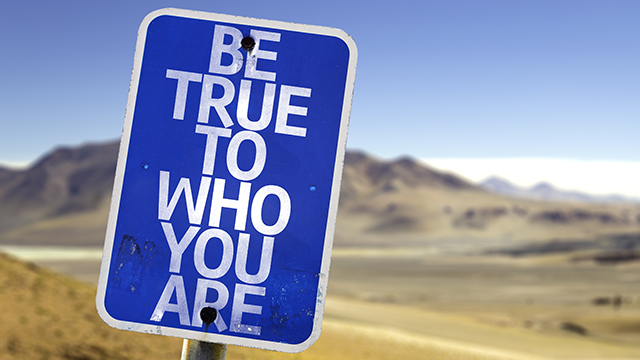Blue Road Sign in Desert: "Be True to Who Are ."