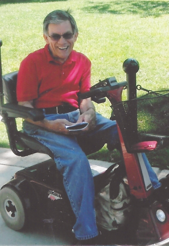 Jim Hasse sits in his Amigo electric scooter in 2012.