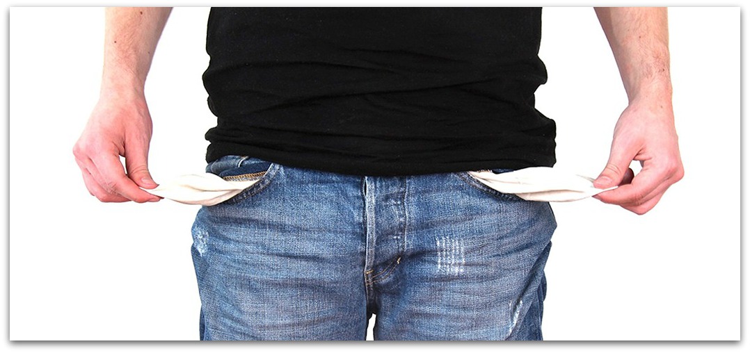 Photo of man showing nothing in his jeans pockets.