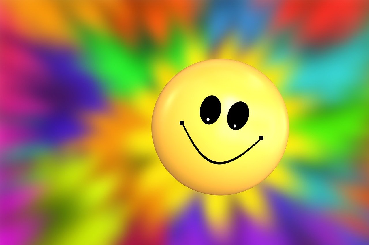 For inspirational stories: Humor, Joy, Yellow Happy Face with background of bright colors.